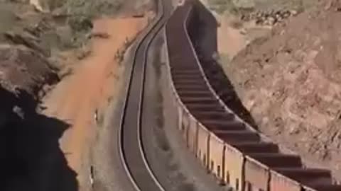 The BHP Train from Australia consisting of 682 carriages with 8 locomotives, carrying iron ore.