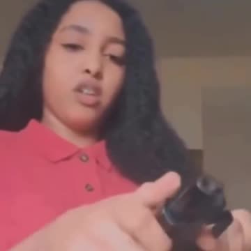 Mixed negro teenaper almost kills herself accidentally......don't play with guns!