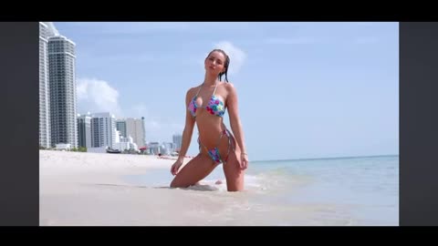 Very beautiful beach, beautiful azure blue sea and an absolutely hot bikini babe....
