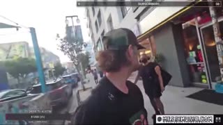 obese man wearing a dress attacks another man for wearing a Trump hat