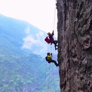 Thrilling rock climbing on Mount Yandang in Zhejiang Province, China.