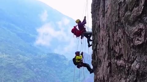 Thrilling rock climbing on Mount Yandang in Zhejiang Province, China.