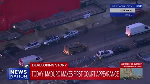 Maduro, handcuffed, is escorted by federal agents to a helicopter on his way to court