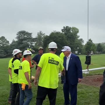 President Donald J. Trump walks out onto the South Lawn to meet with the men installing the new flagpole at the White House.