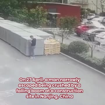 Brush with Death: Man Evades Falling Crane Boom in Dramatic Scene.