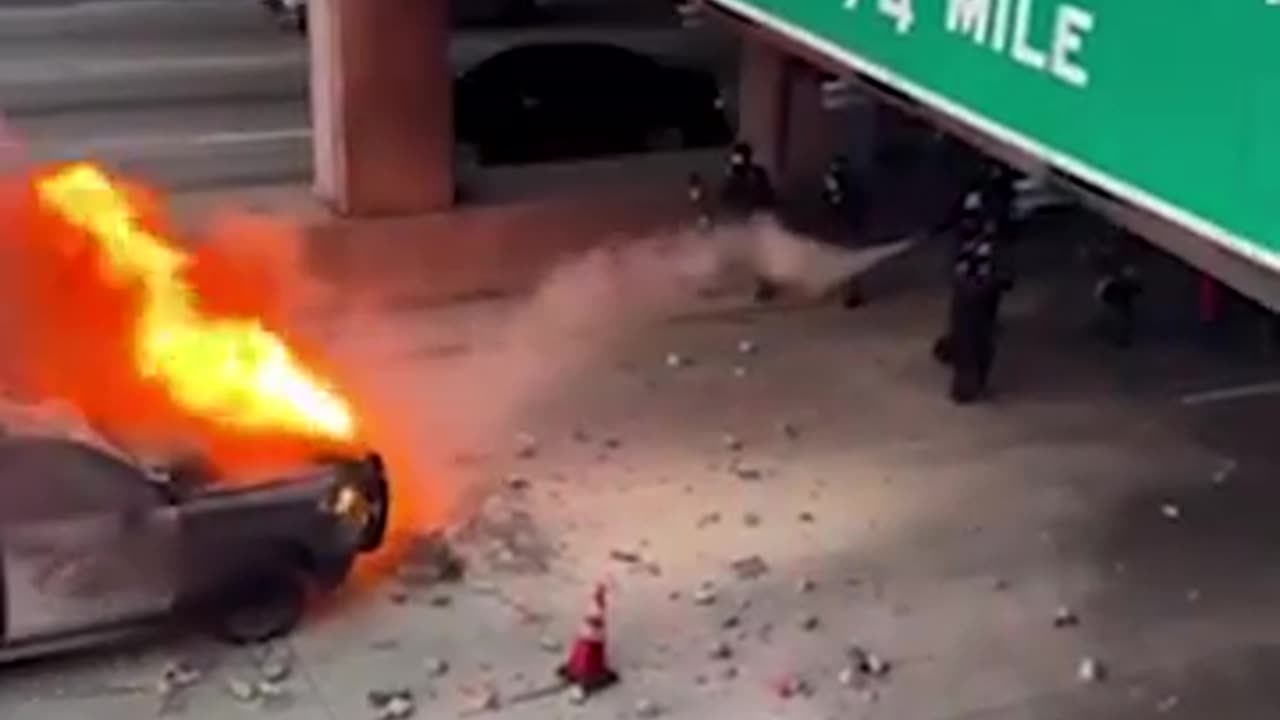 TERRORIST BURNING A POLICE CAR BETWEEN OTHER ACTS