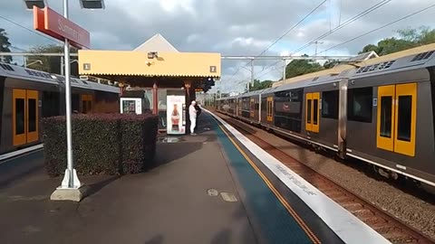 Trains stranded at station and dude shirtless on cold day is a strange scene