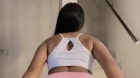 A young hot girl shakes her big sexy ass