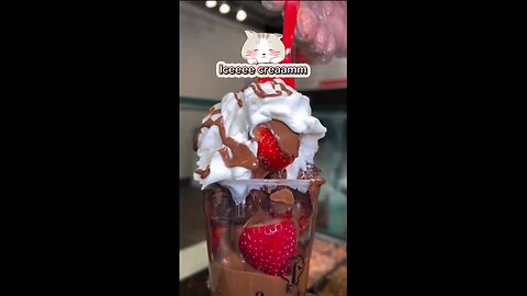 Who loves ice cream? Vanilla ice cream with choco topping and fresh strawbery fruites, yummy dessert