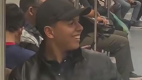 LADY WITH HER ARM UP GETS SPRAYED IN THE SUBWAY