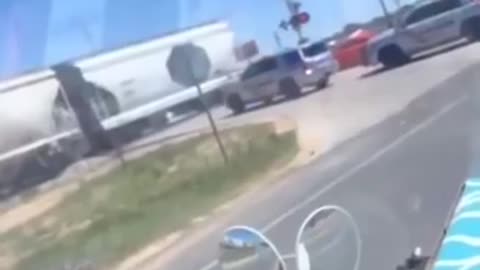 It is neither safe nor legal to cross the RR tracks when the crossing arm is down...