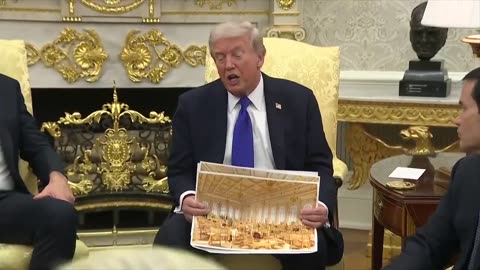 Trump waves around renderings of his new ballroom, which appears to be entirely gold