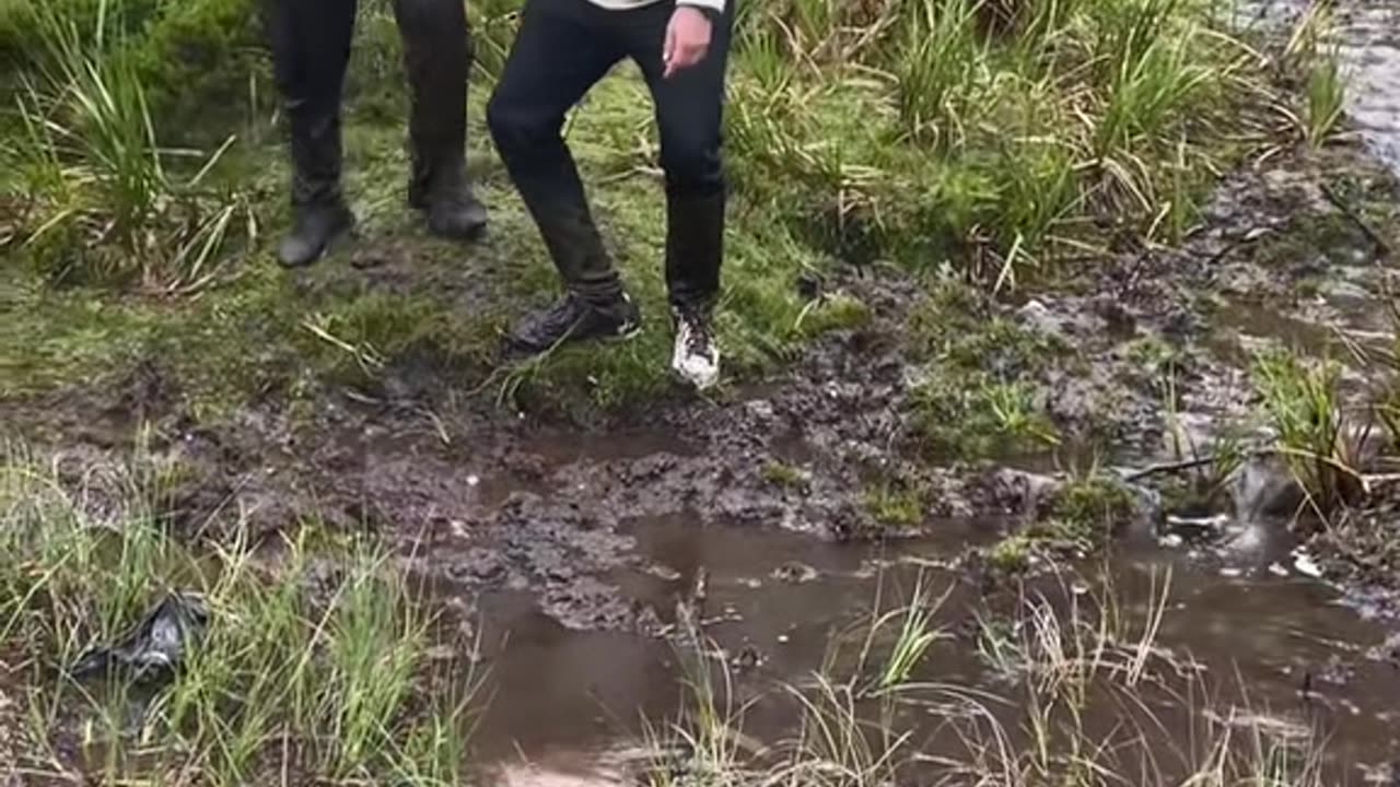Muddy Ground Paints Two Men Brown
