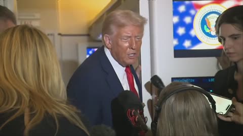 Trump speaks with reporters aboard Air Force One