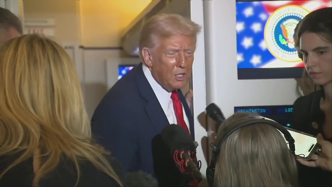 Trump speaks with reporters aboard Air Force One