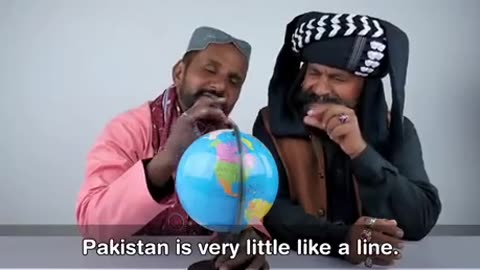 TRIBAL PEOPLE DISCOVERING THE GLOBE FOR THE FIRST TIME