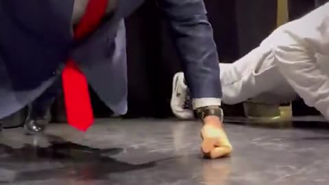 Poland's new president, Karol Nawrocki easily defeats a young man in a push-up competition