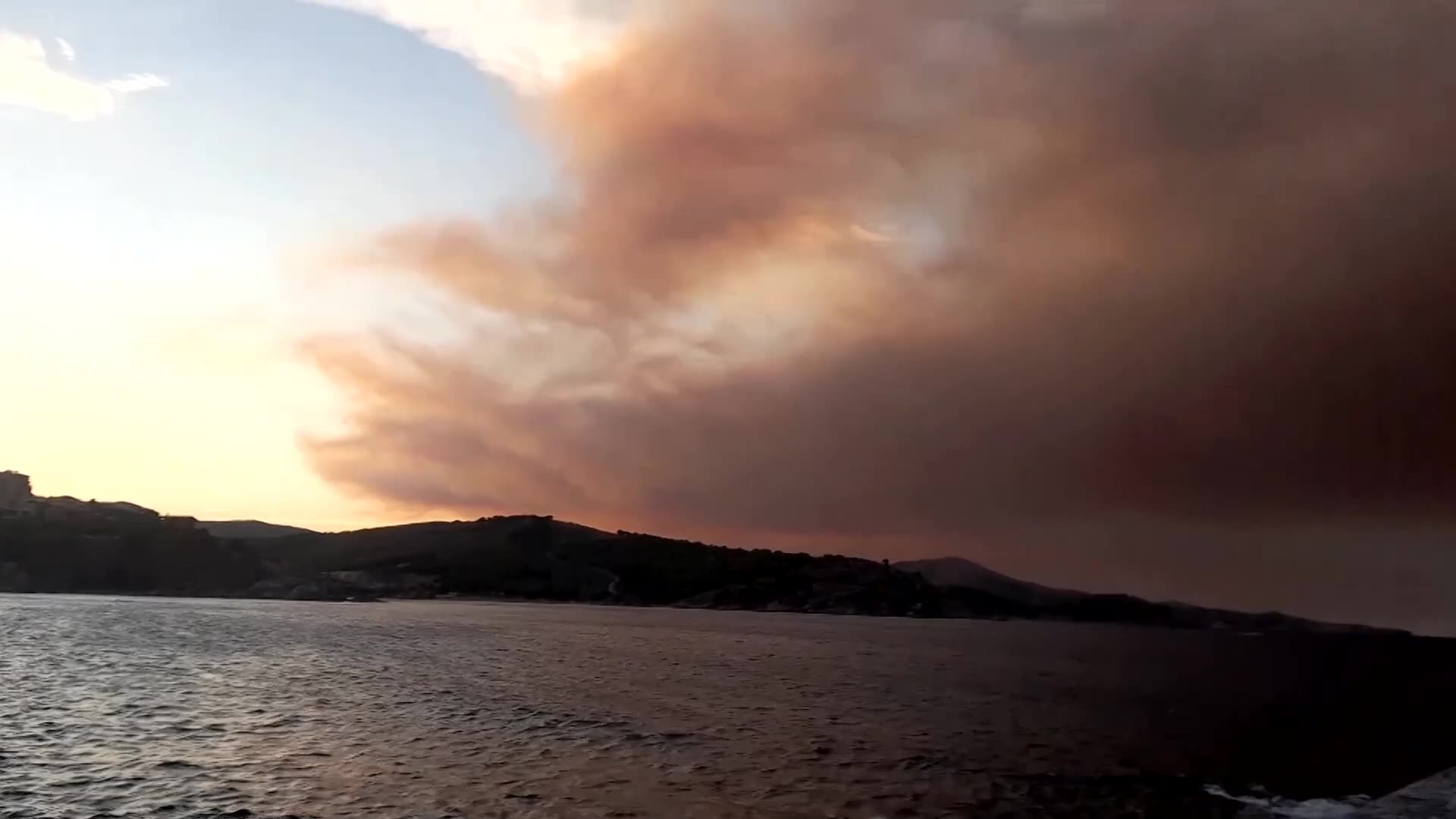 Smoke rises over the coast in southern France as wildfire rages on