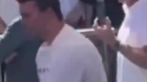 2 men standing behind Charlie Kirk look like they gave hand signals right before the shot went off