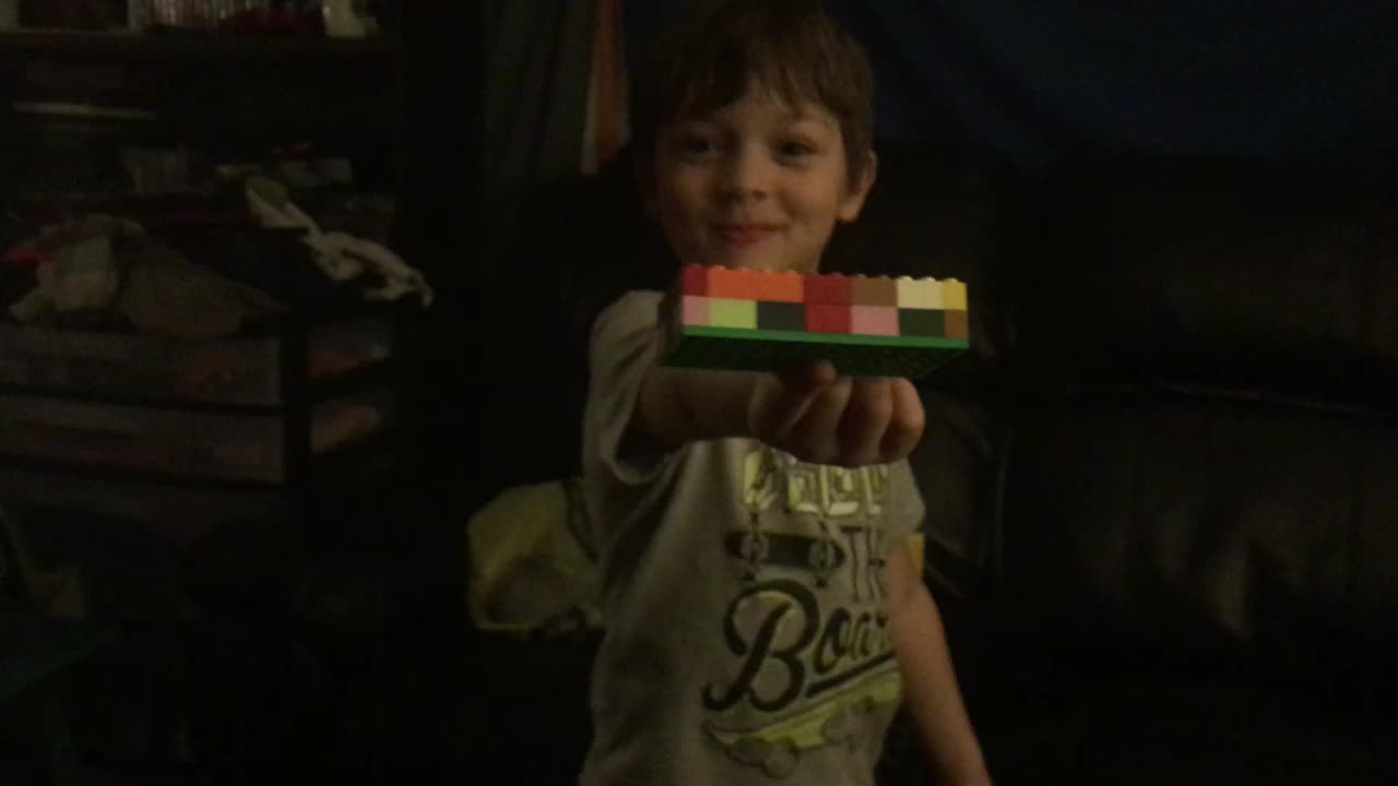 Grandson showing what he built with legos
