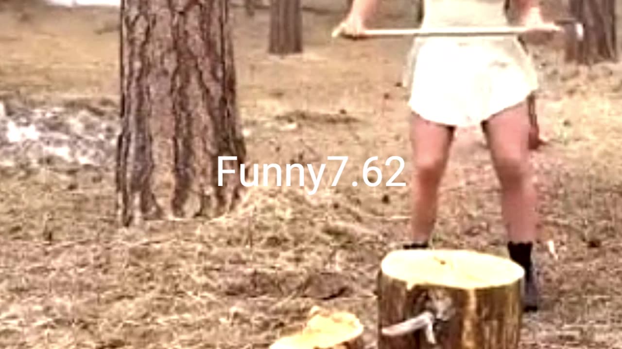 Hardworking Girl Chops Wood Alone