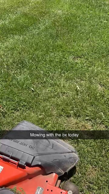Bx2380 mowing the yard