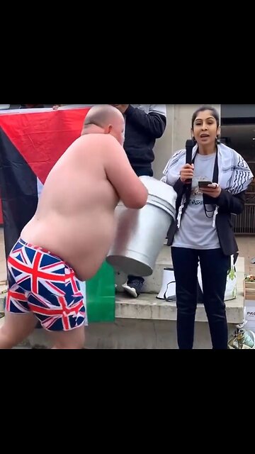 British patriot drenches pro Palestine protestor with bucket of water.