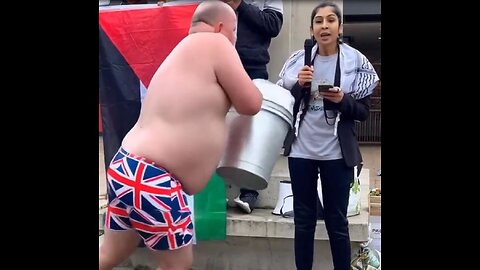 British patriot drenches pro Palestine protestor with bucket of water.
