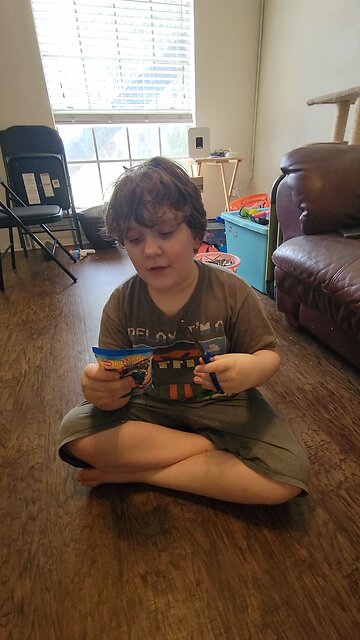 opening a Hot Wheels Mistery pack