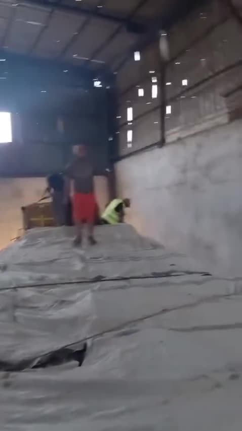 Hamas terrorists take the aid trucks directly into their warehouse. Watch!