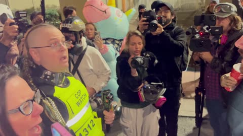 Agitated protestor accuses @nicksortor of “stealing” a flag from Richard Hernandez