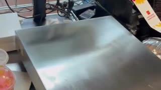 A McDonalds is adjusting to the consequences of a low trust society.