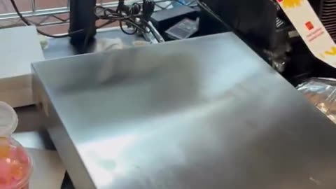 A McDonalds is adjusting to the consequences of a low trust society.