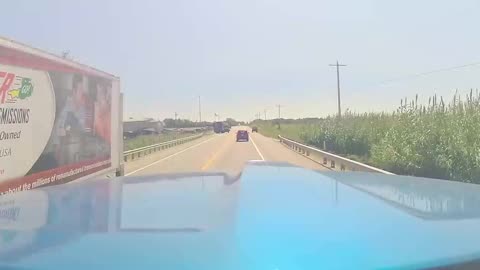 Near Miss With Semi As Woman Falls Out of Utility Vehicle