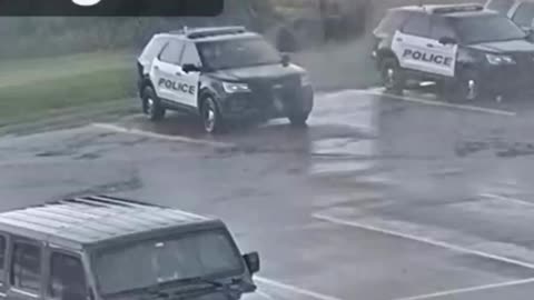 Lightning strikes police vehicle in parking lot!