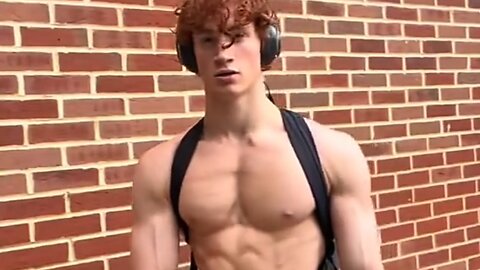 Handsome muscular man showing off his muscles