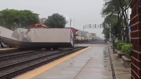 Freight train collides into semi-trailer truck in LaGrange, Illinois; no injuries reported.