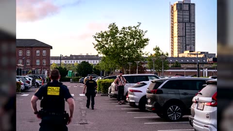Climber scales, leaps off Denmark hotel in base jump stunt