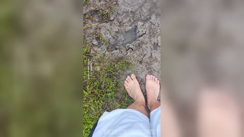 Bare feet playing in the mud
