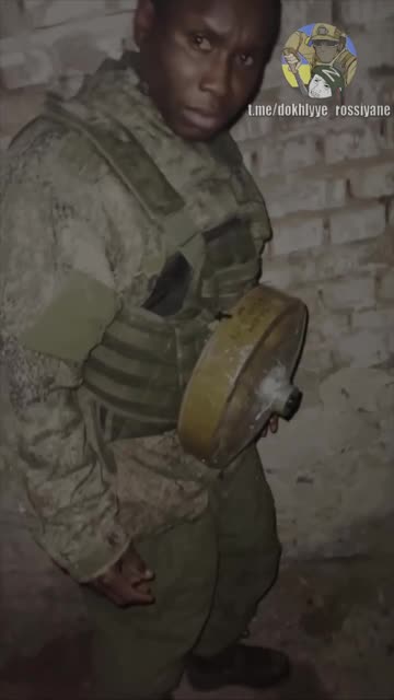 African Mercenary Has Landmine Strapped to His Chest As Punishment for Trying to Run