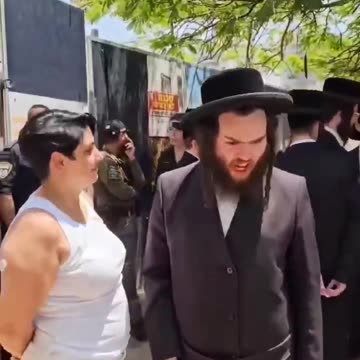 Jew caught on video freaking out just because a Christian woman stood near him