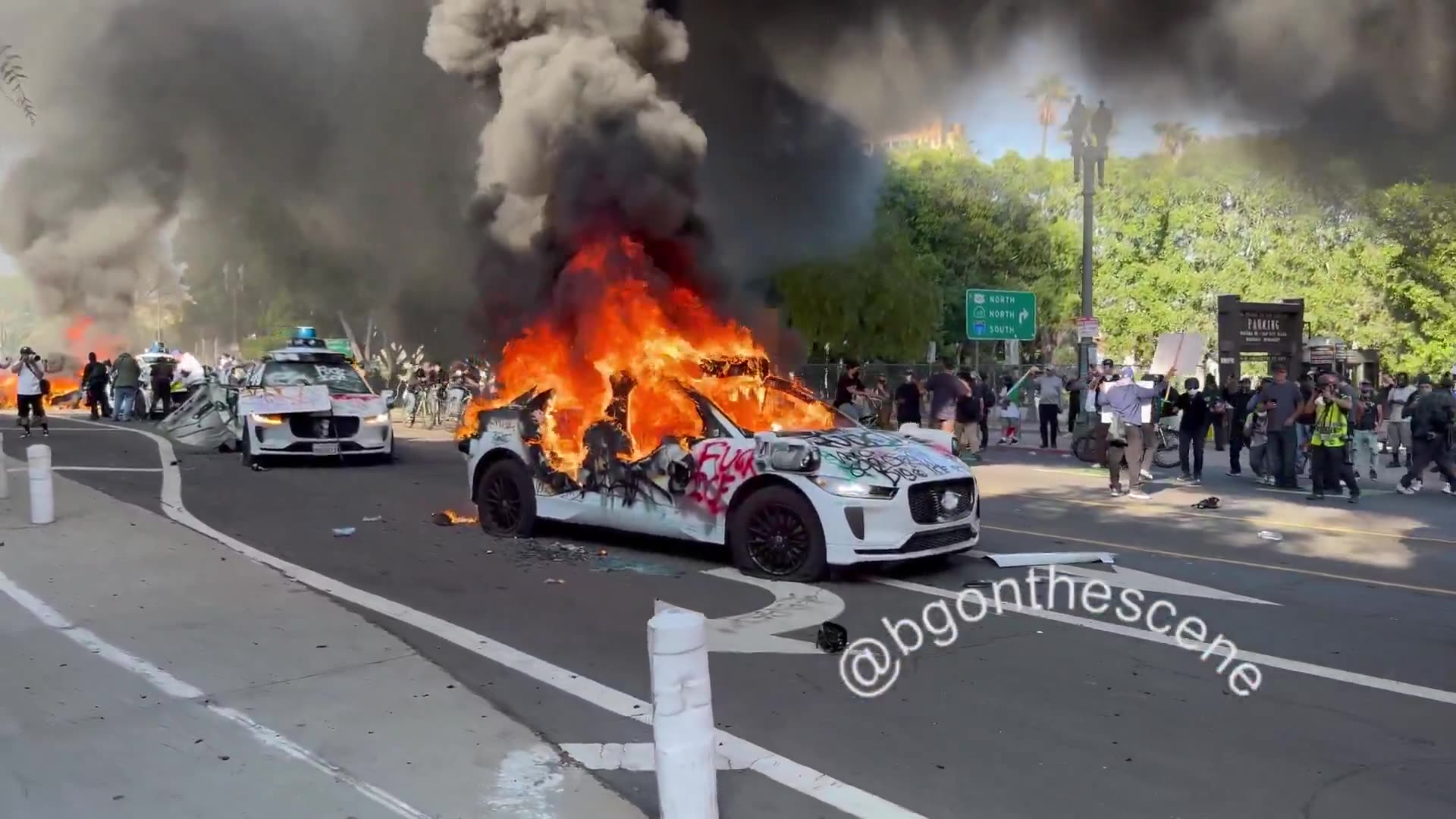 LINES OF CARS are now burning in the streets of Los Angeles,