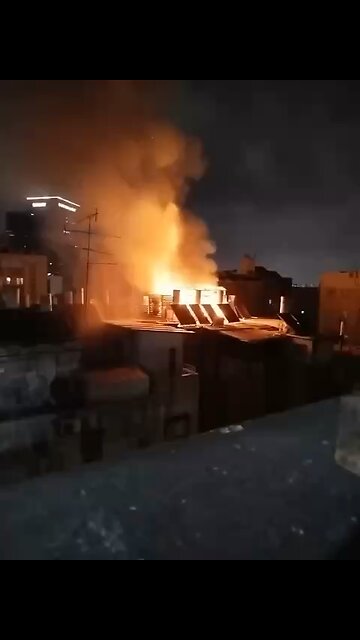 Rooftop Engulfed in Flames After Israeli Interceptor Malfunction — Haunting Distant View