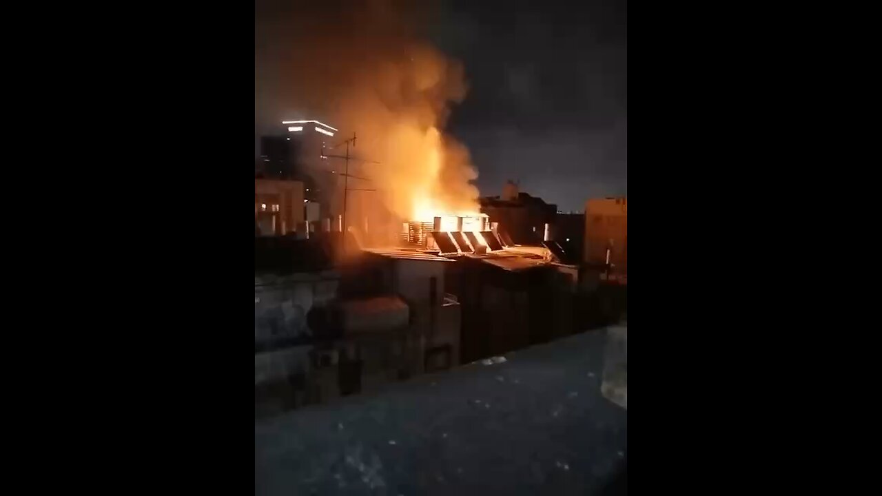 Rooftop Engulfed in Flames After Israeli Interceptor Malfunction — Haunting Distant View