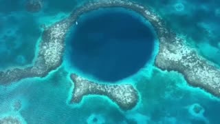 The big blue Hole A circular sinkhole in the center of Lighthouse Reef Atoll