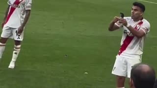 Marcos Acuna showing Denzel Dumfries his shin pad with the World Cup trophy