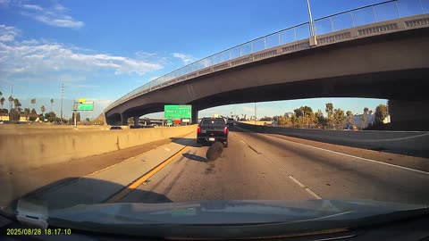 Runaway Spare Tire Narrowly Misses Car