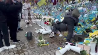 Heroes' Alley in Kyiv — Fight by Portraits of Fallen Soldiers. Man Chokes Woman. Considered Normal