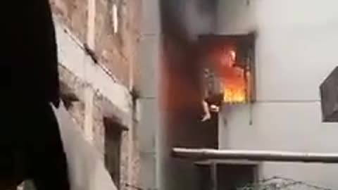 poor man stuck in burning flat