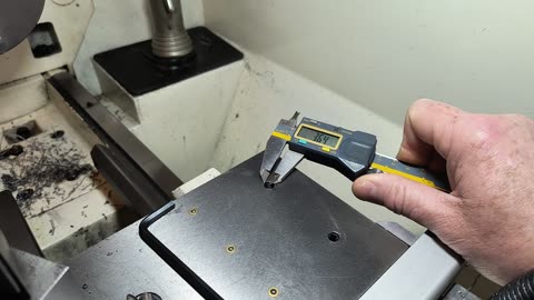 measuring hole spacing with a caliper